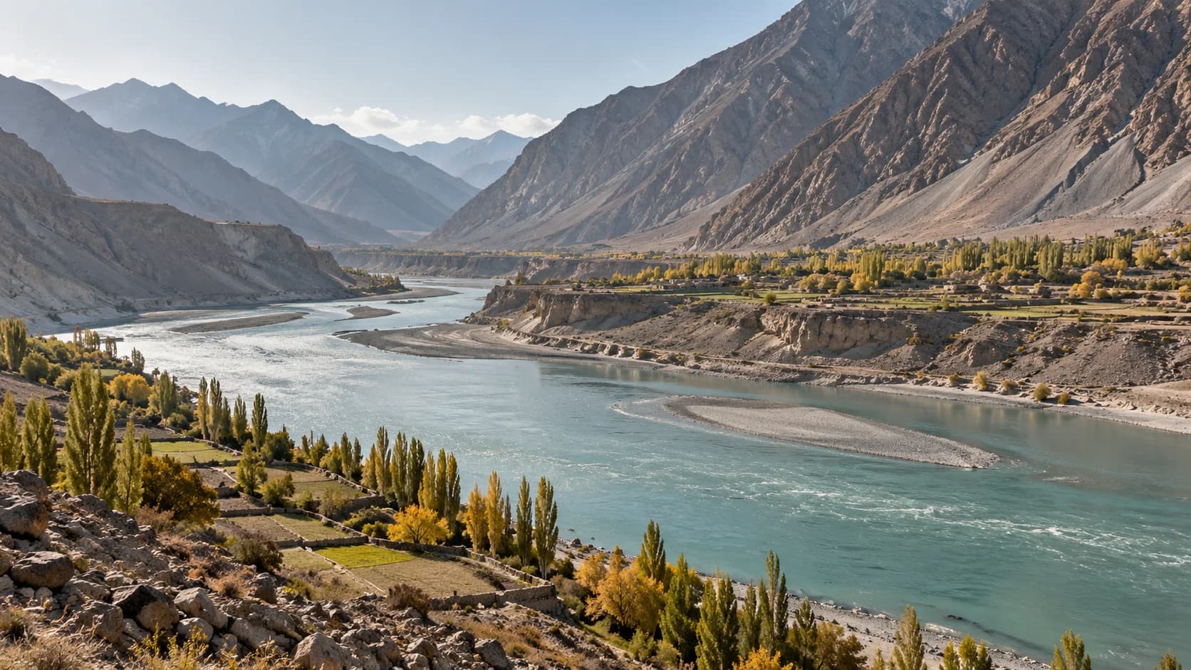 An artistic landscape of the turquoise Indus winding through the dry Skardu valley
